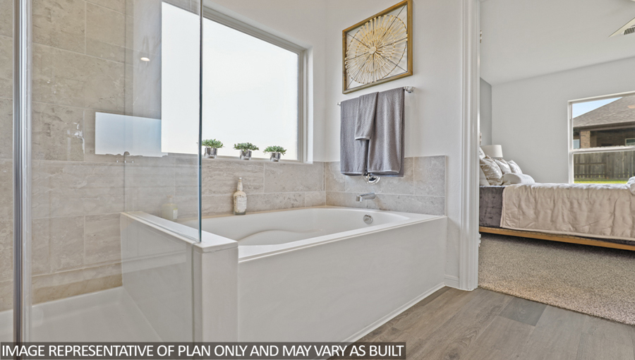 Primary bathroom with tub and shower