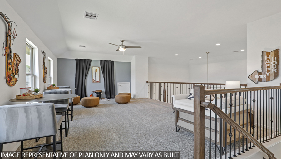 Second story game room with carpet flooring