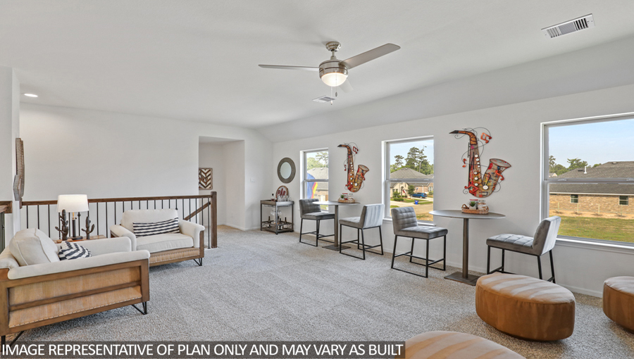 Second story game room with carpet flooring