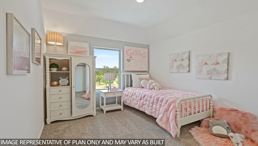 Secondary bedroom with carpet flooring
