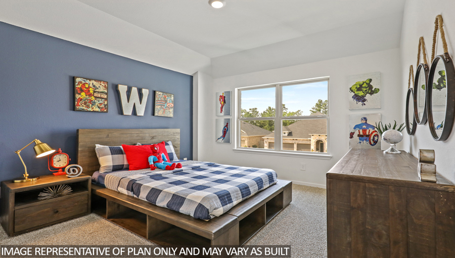 Secondary bedroom with carpet flooring