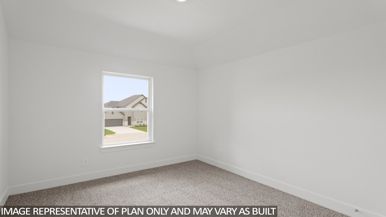 Secondary bedroom with carpet flooring