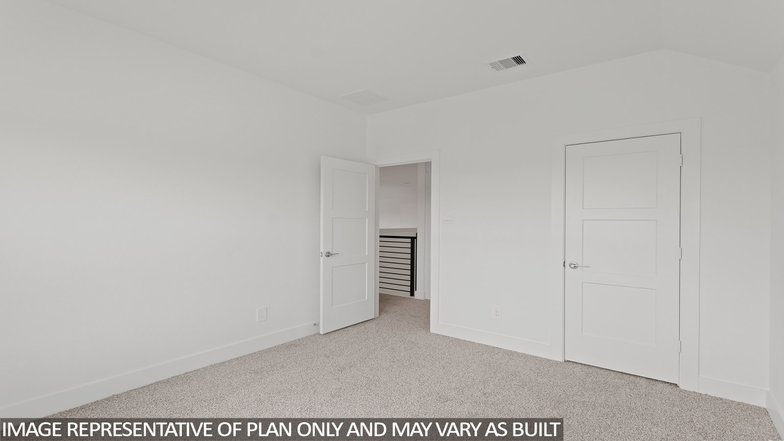 Secondary bedroom with carpet flooring