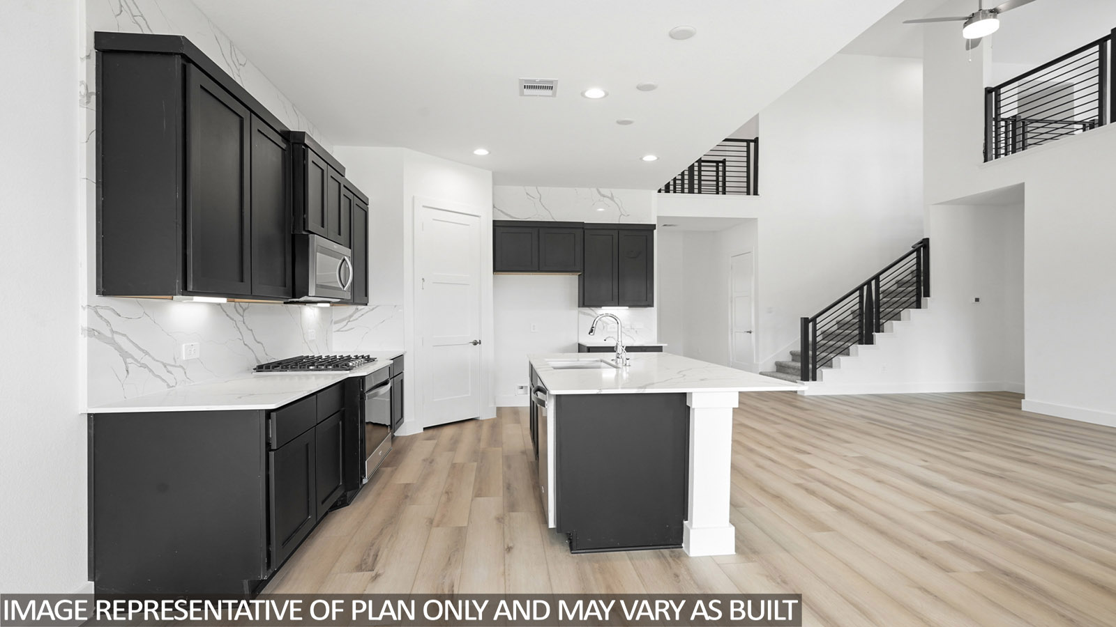Kitchen with an island and vinyl floor