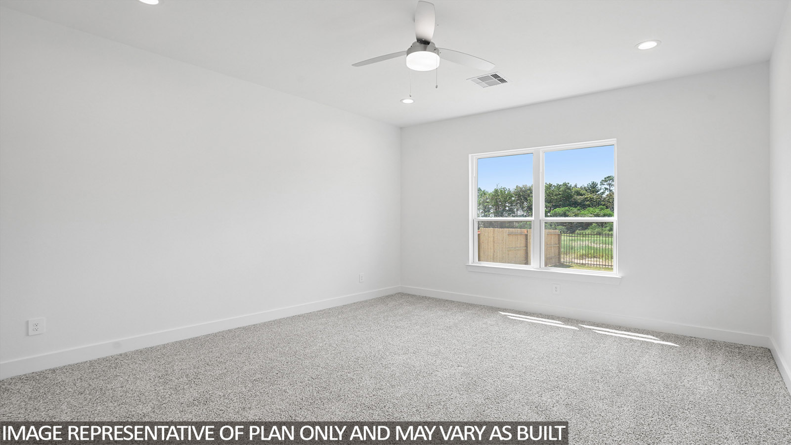 Primary bedroom with carpet flooring