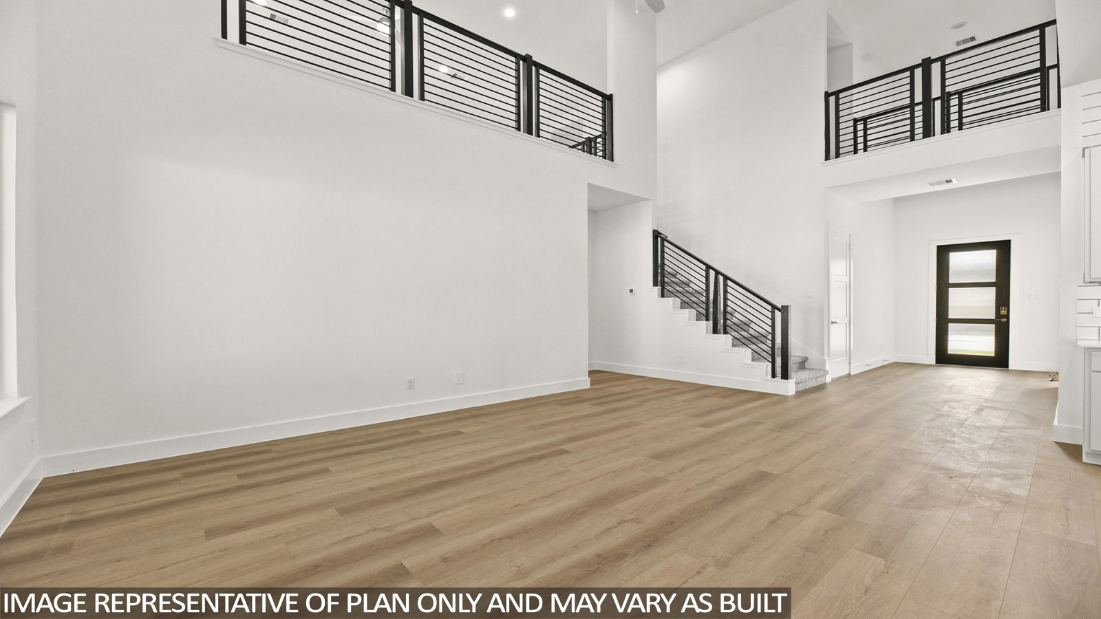 open concept living area with vinyl flooring, large windows and high ceilings