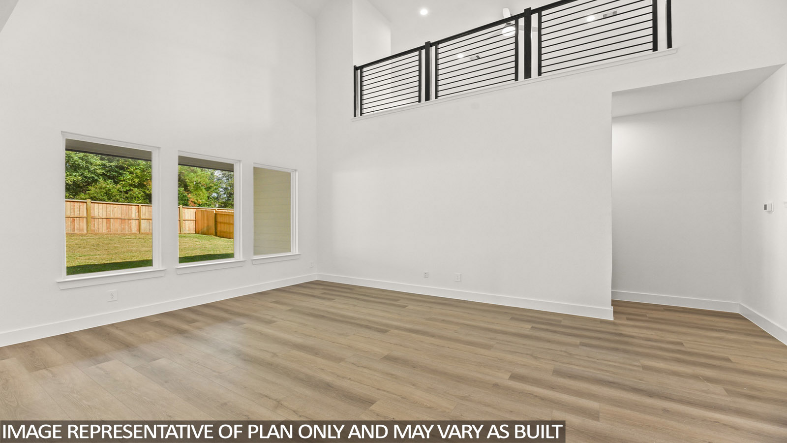 open concept living area with vinyl flooring, large windows and high ceilings