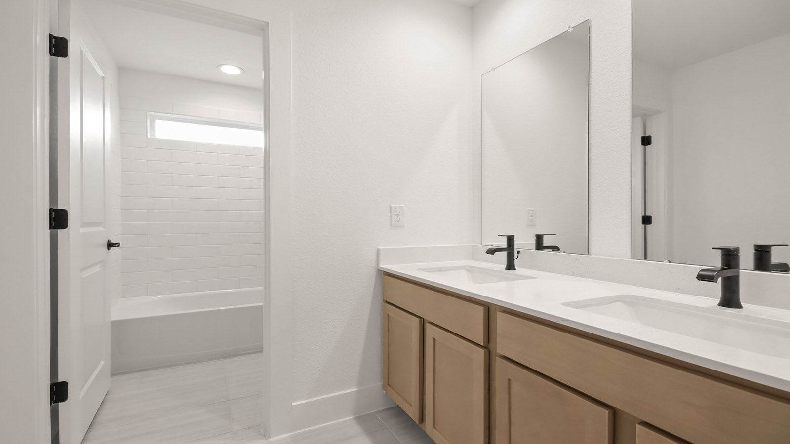 Secondary bathroom with double sinks quartz counter tops in Magnolia TX