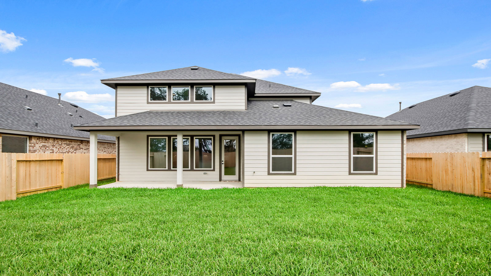 covered patio with jamies hardie siding and overhead lighting