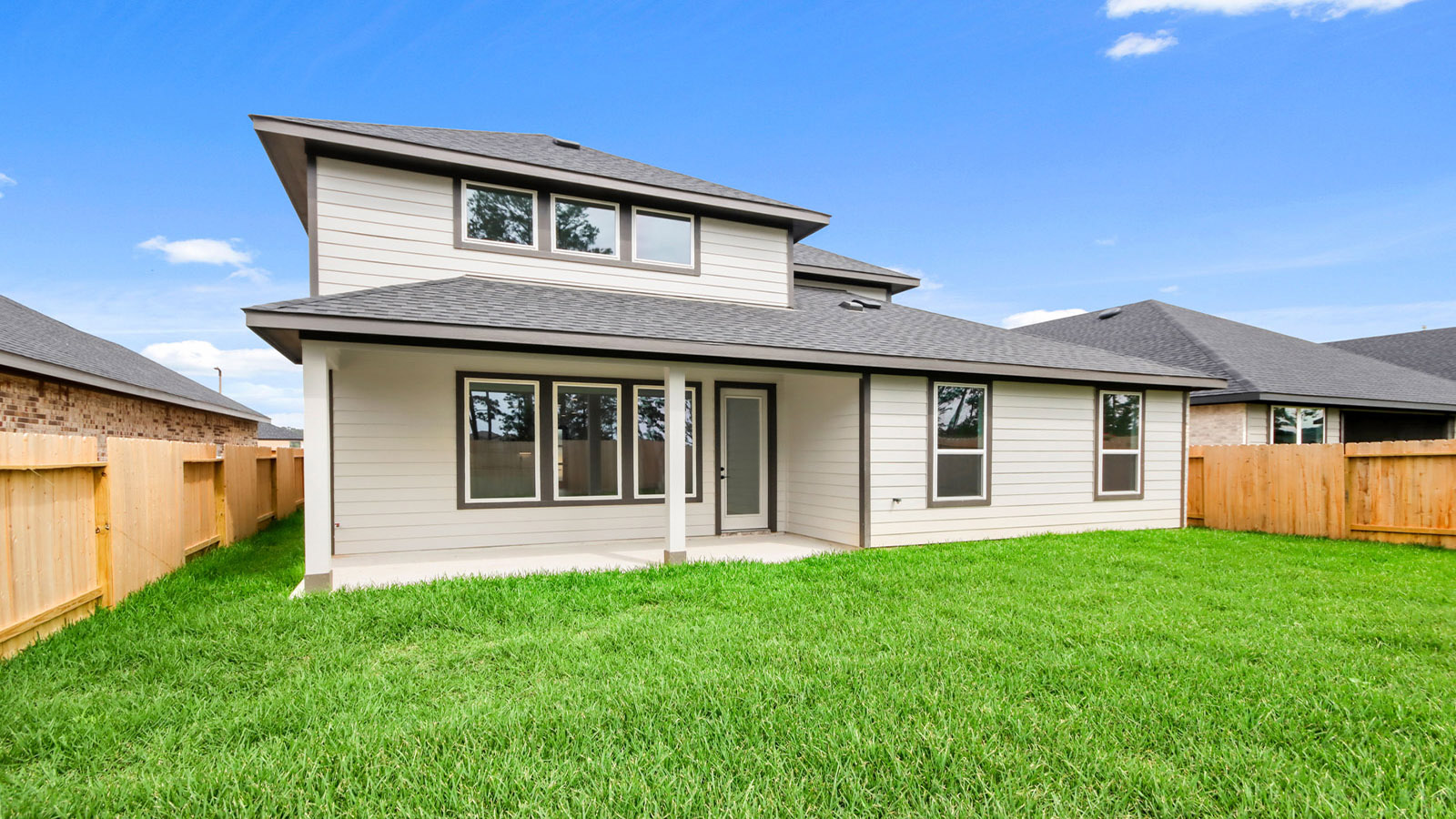 covered patio with jamies hardie siding and overhead lighting