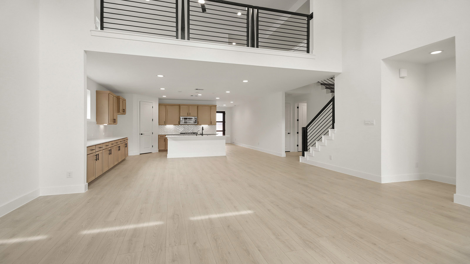 Spacious living area with vinyl flooring and bright windows in Magnolia TX