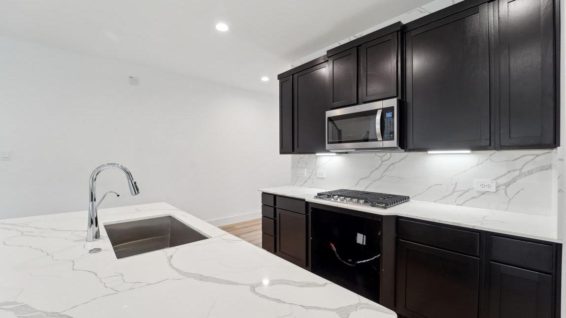 kitchen with stainless steel appliances and quartz countertops
