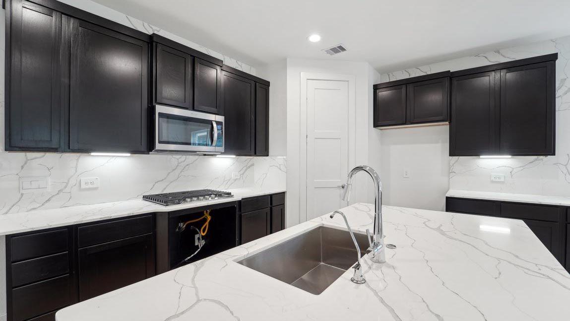 kitchen with stainless steel appliances and quartz countertops