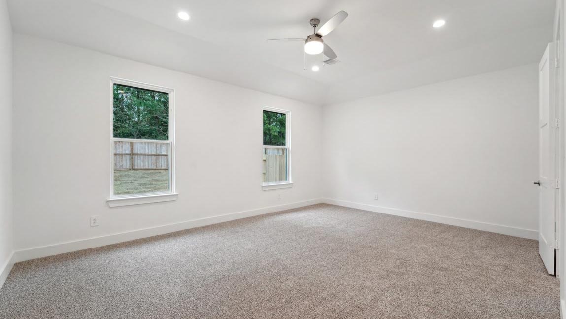 bedroom with carpet flooring and windows