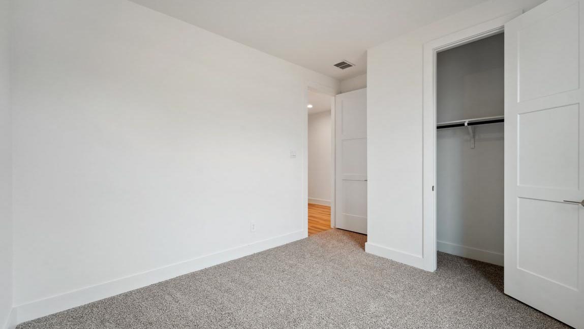 bedroom with carpet flooring and windows