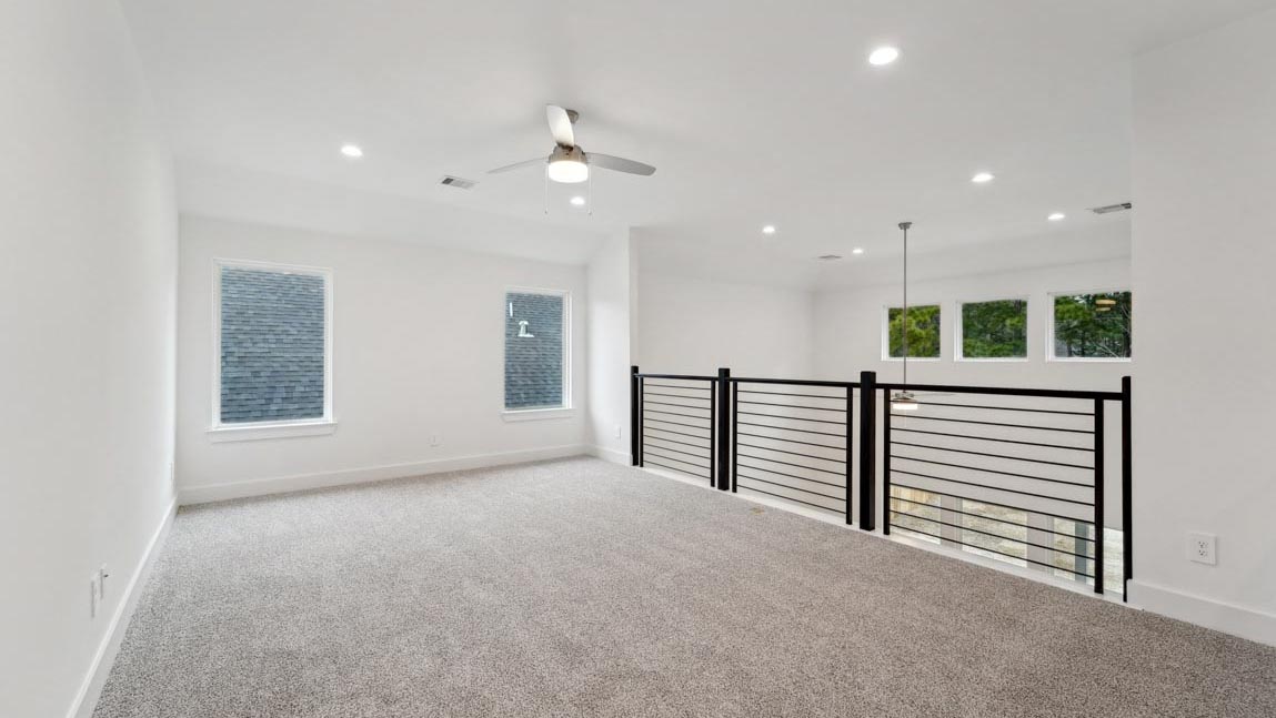 bedroom with carpet flooring and windows