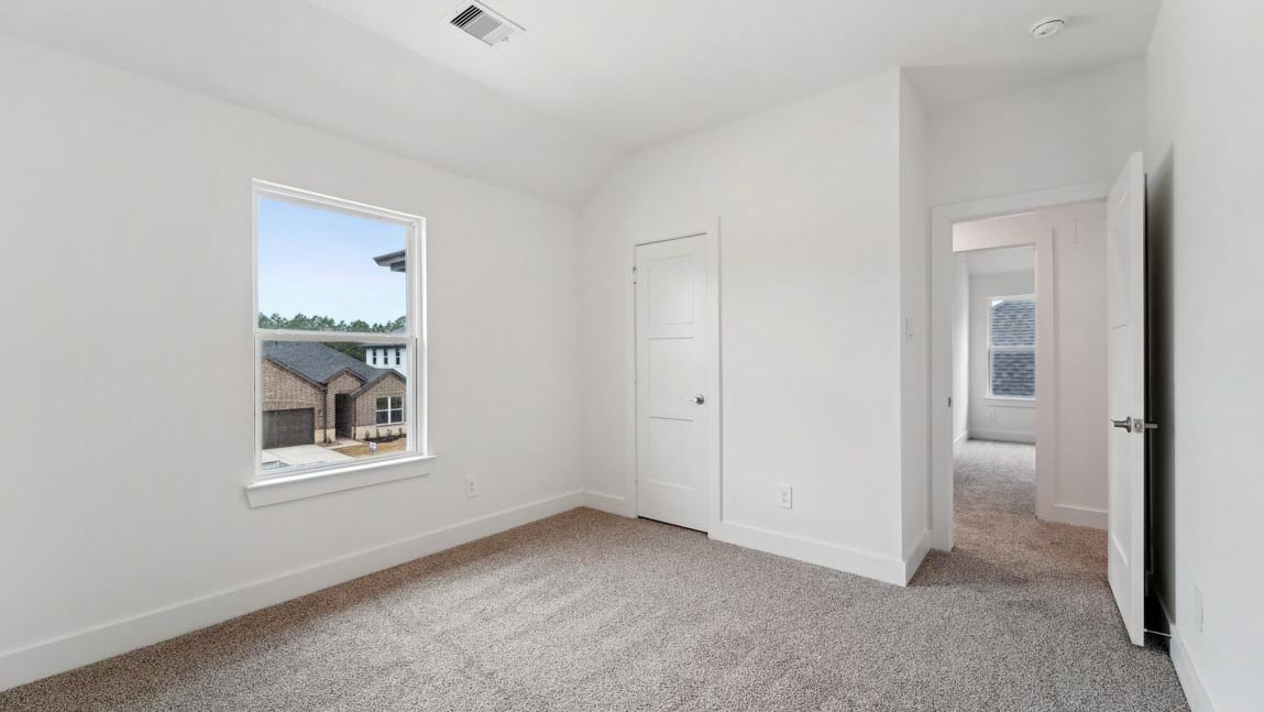 bedroom with carpet flooring and windows