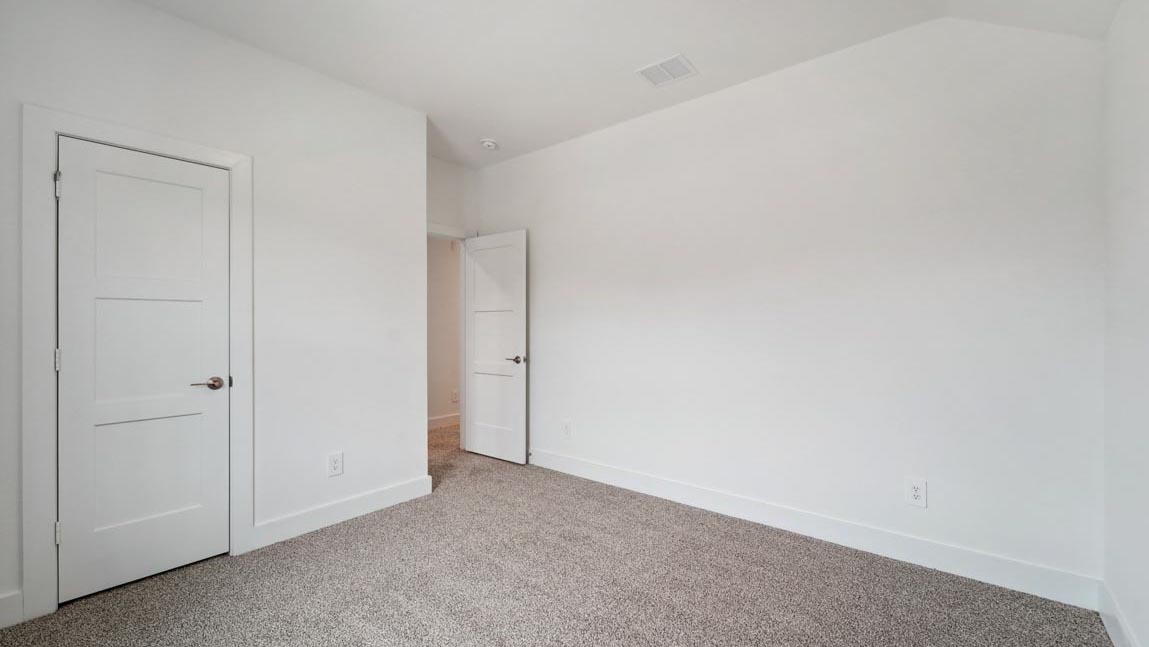 bedroom with carpet flooring and windows