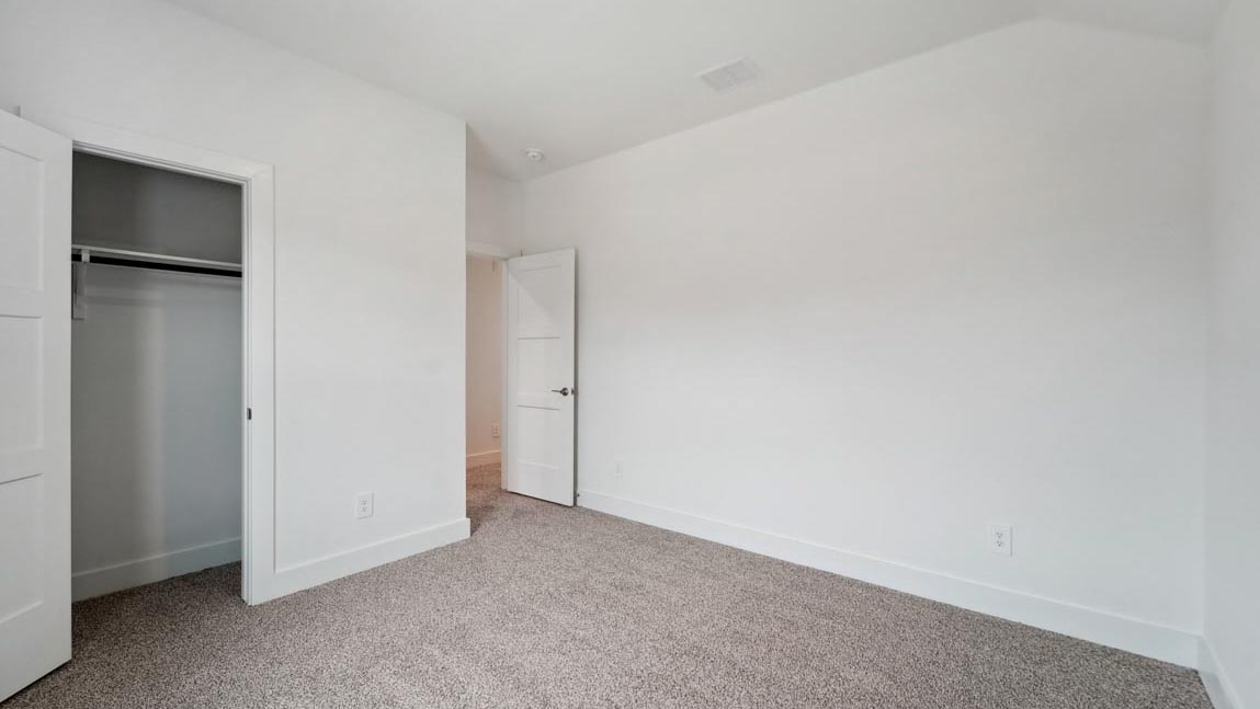 bedroom with carpet flooring and windows
