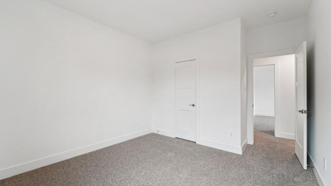 bedroom with carpet flooring and windows