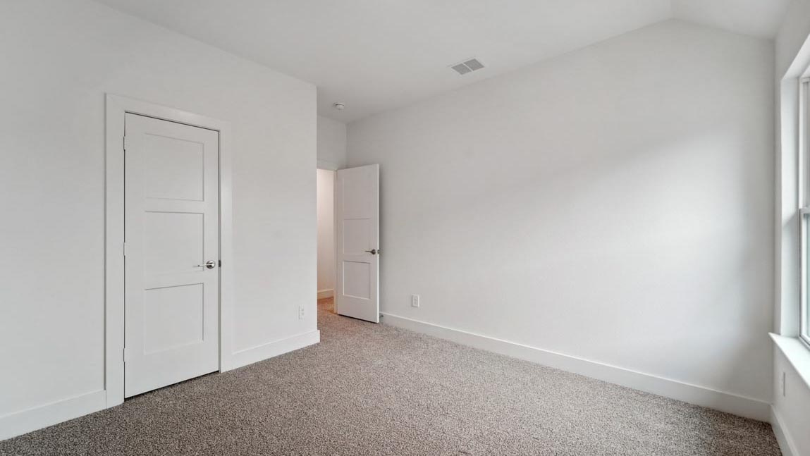 bedroom with carpet flooring and windows