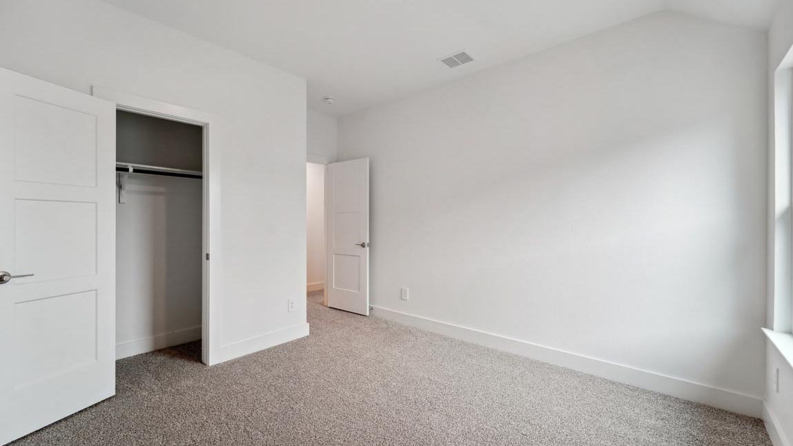 bedroom with carpet flooring and windows