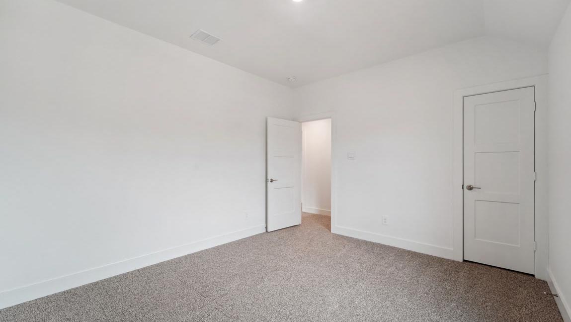 bedroom with carpet flooring and windows