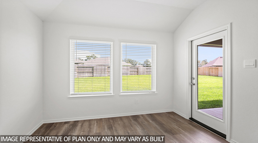 Dining area with bright windows.