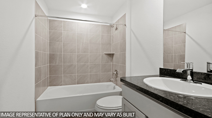 Secondary bathroom with tub/shower combo.