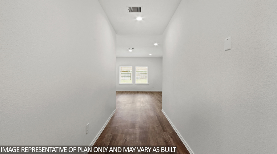 Entryway with vinyl flooring.