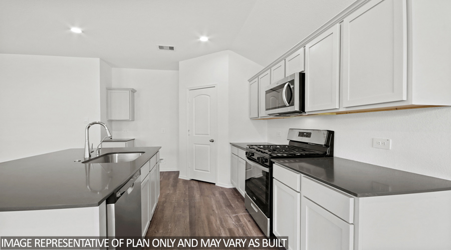 Kitchen with stainless-steel appliances.