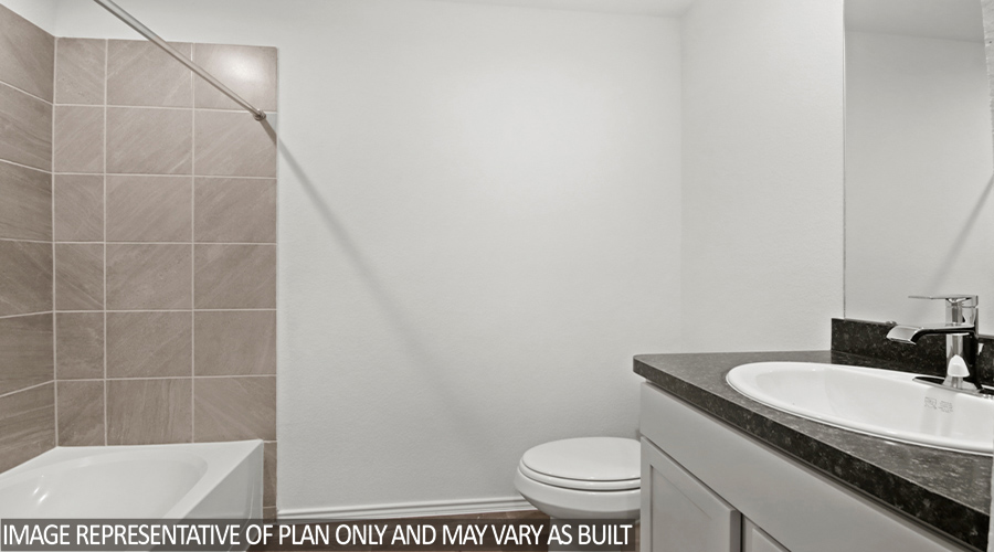 Secondary bathroom with tub/shower combo.