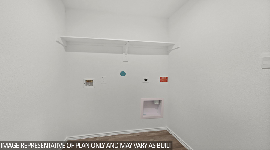 Utility room with overhead space for storage.