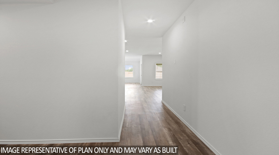 Entryway with vinyl flooring.