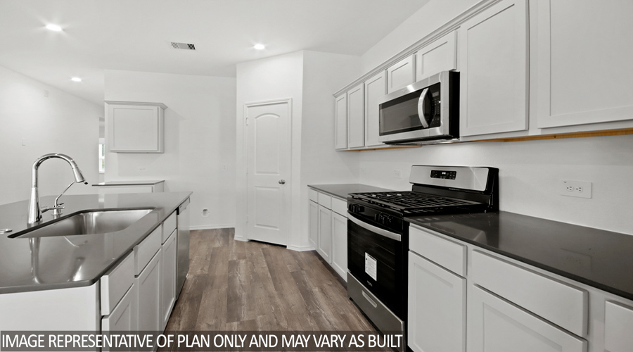 Kitchen with stainless-steel appliances.