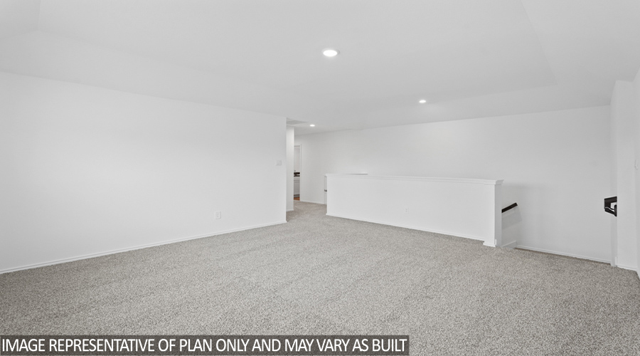 Upstairs game room with carpet flooring.