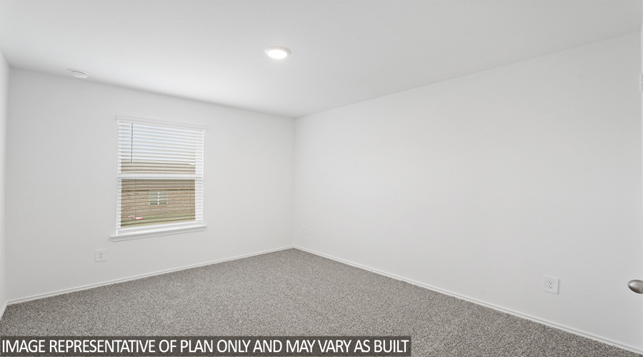 Secondary bedroom with bright window.