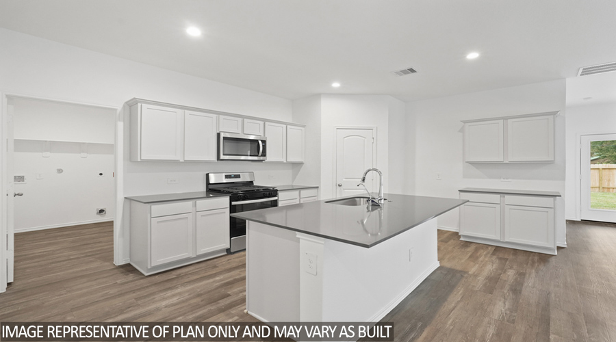 Kitchen with stainless-steel appliances and island.