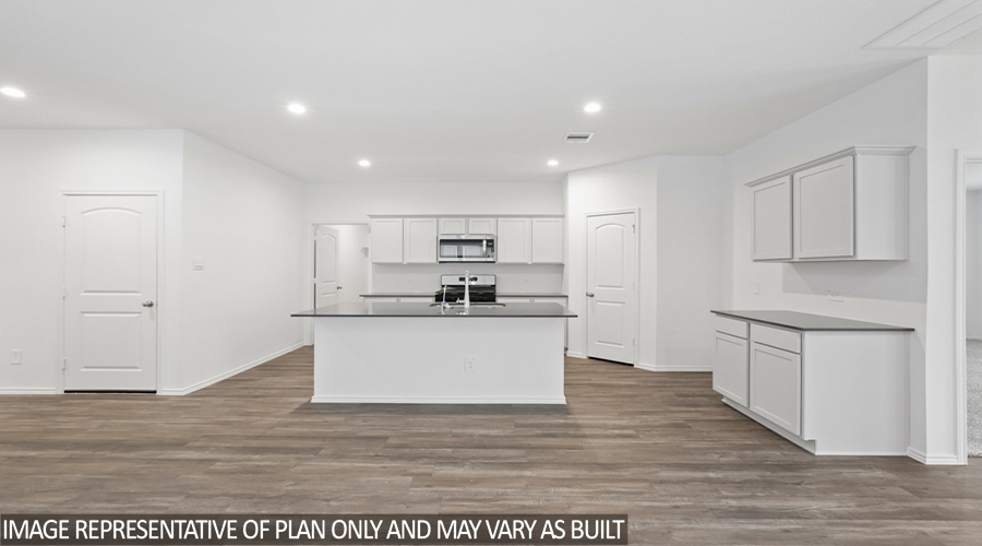 Kitchen with vinyl flooring.