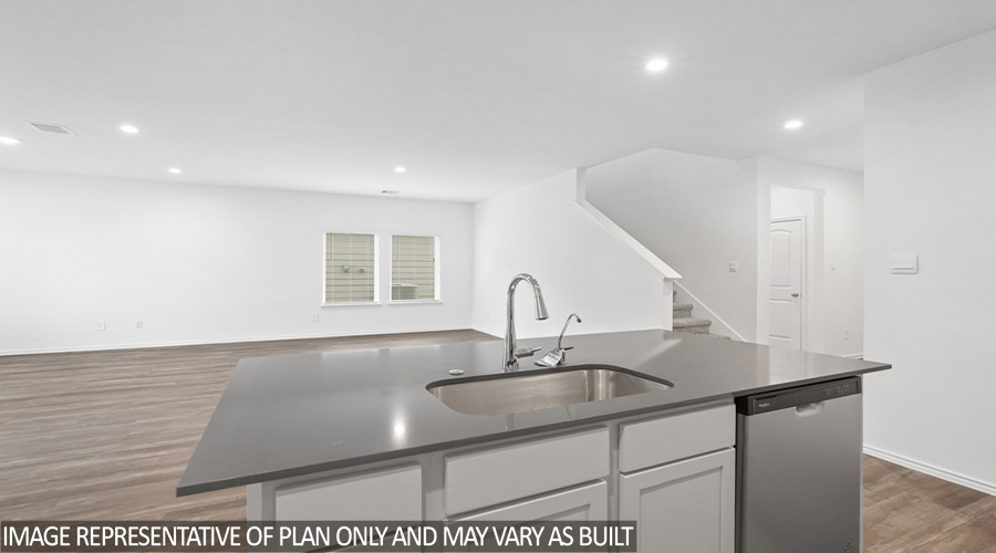 Kitchen and open concept living and dining space.
