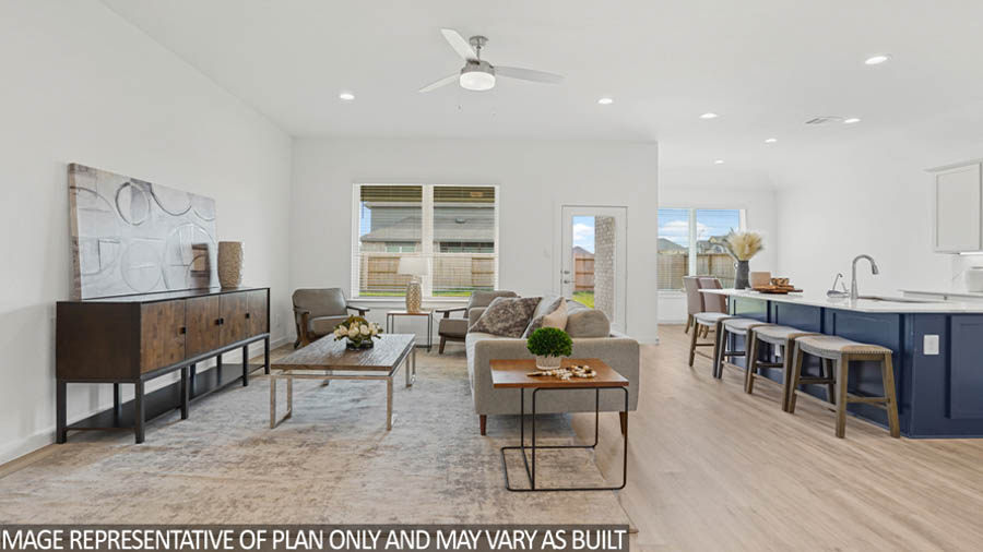 Spacious living area with vinyl flooring