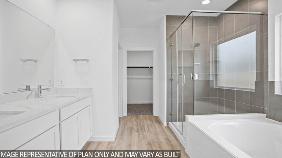 Primary bathroom with tub and shower