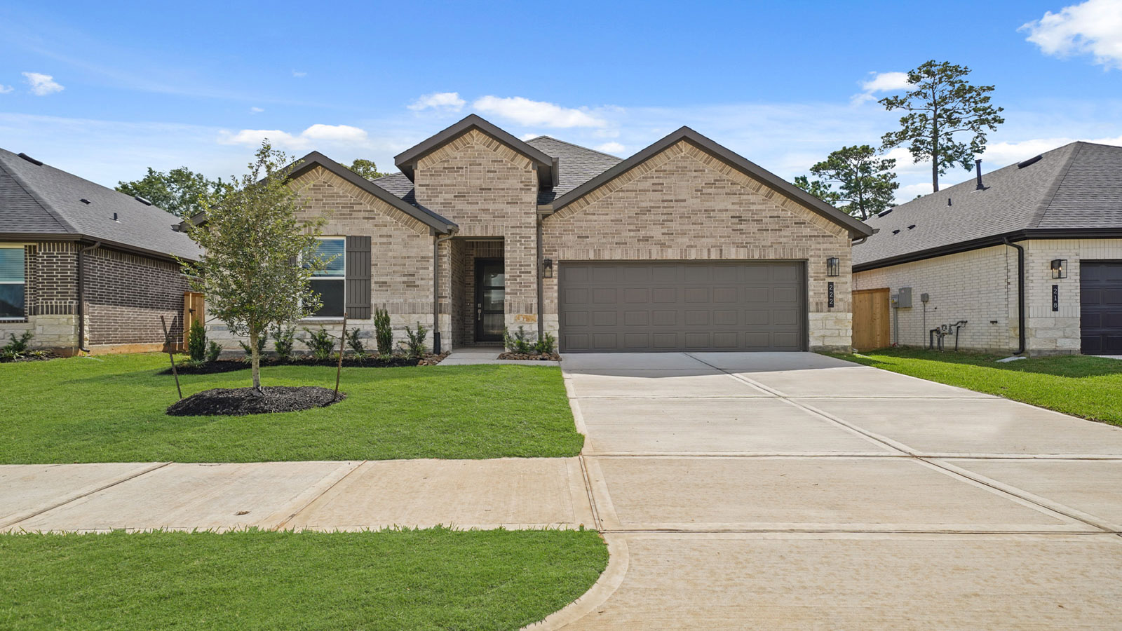 Front of the one-story home with brick.
