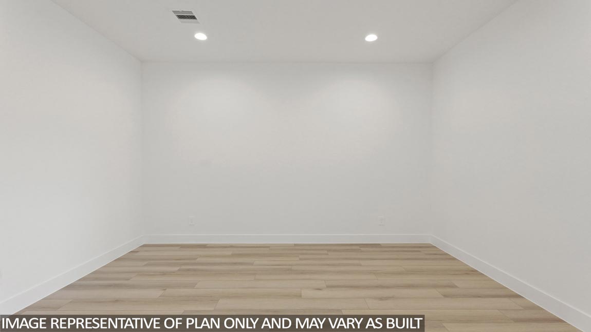 Spacious living area with vinyl flooring