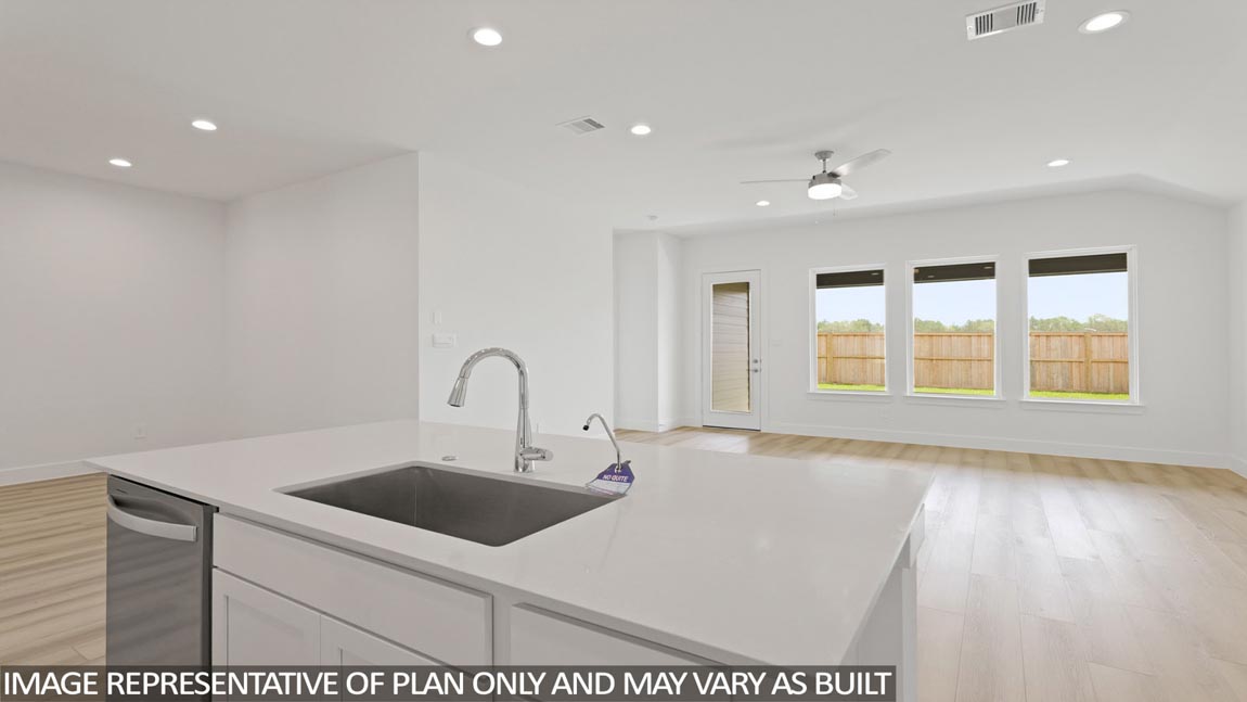 Kitchen with an island and vinyl floor