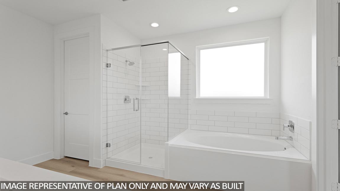 Primary bathroom with tub and shower