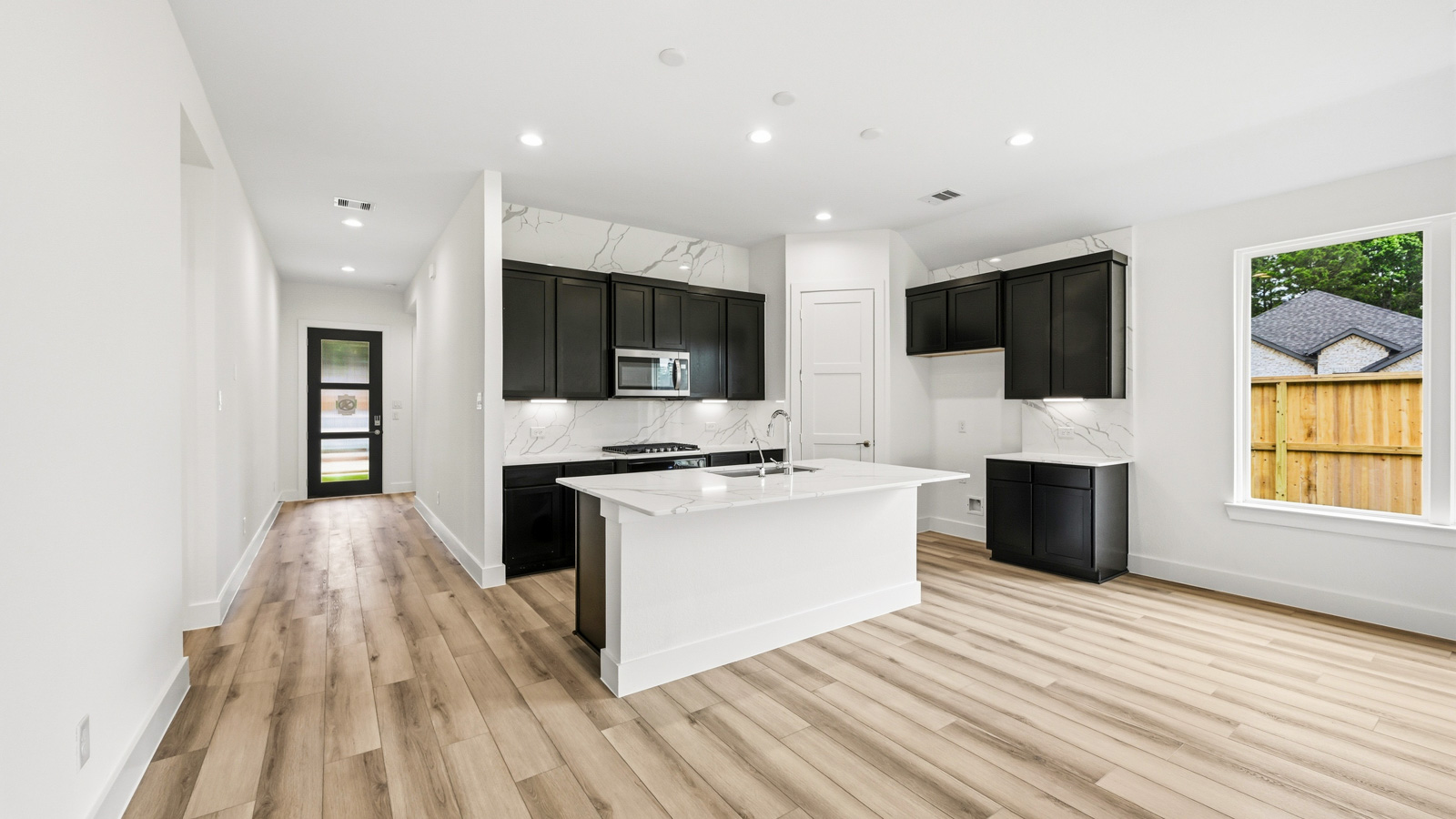Kitchen with an island and vinyl floor