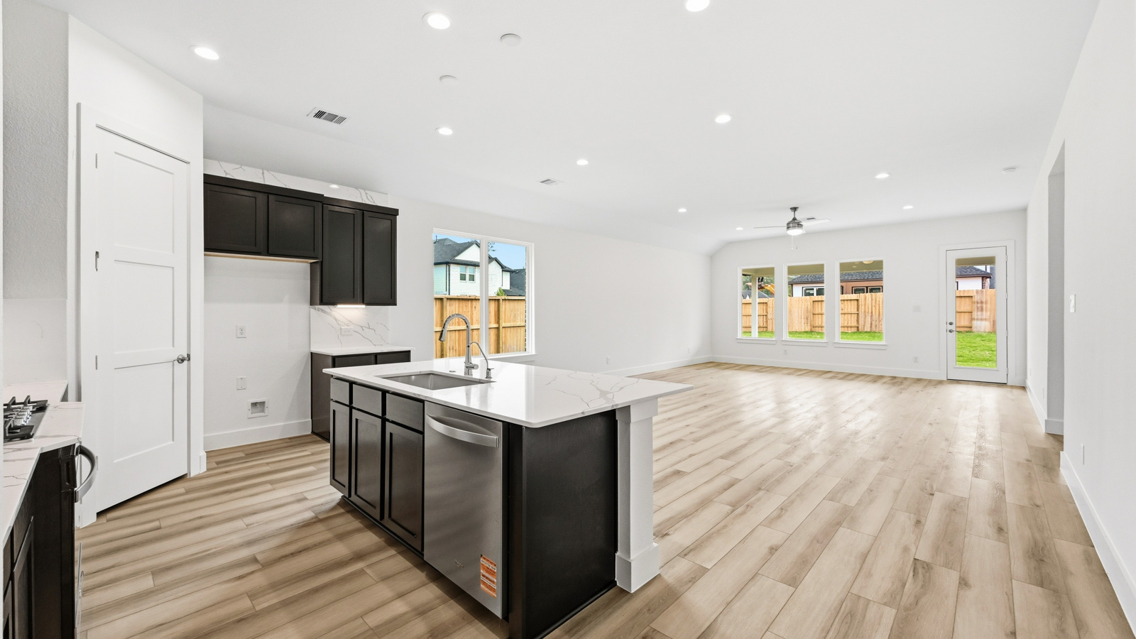 Kitchen with an island and vinyl floor