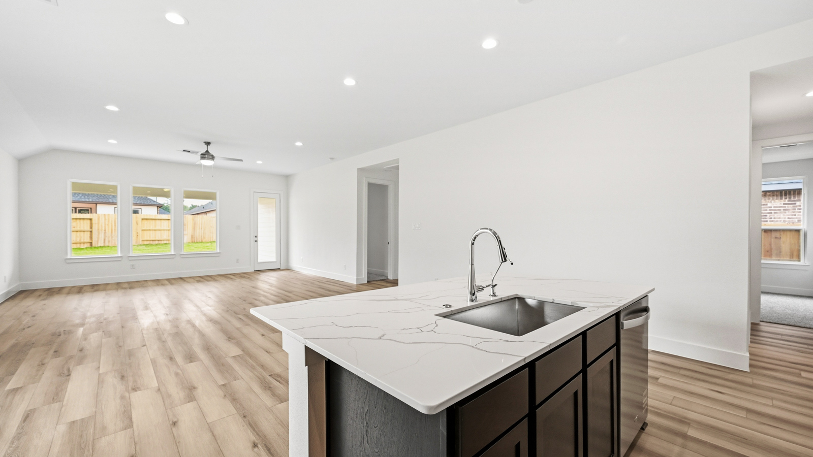 Kitchen with an island and vinyl floor