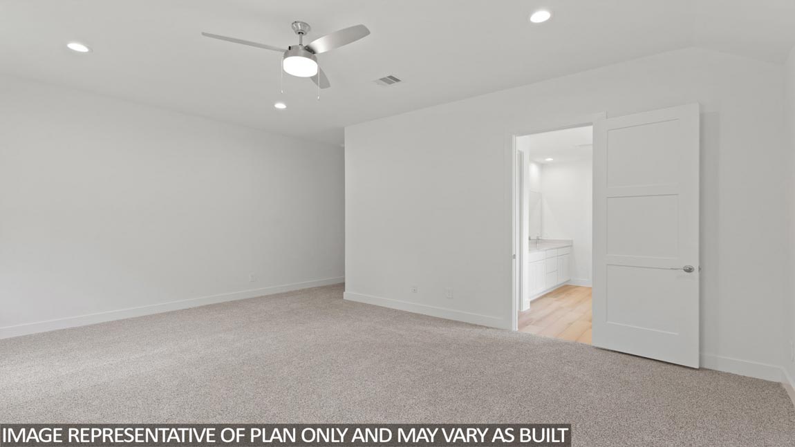 Primary bedroom with carpet flooring